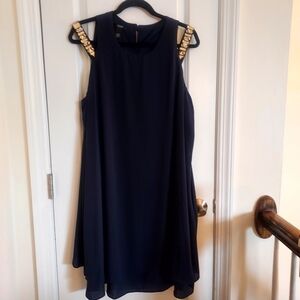 Navy cocktail dress with gold accent